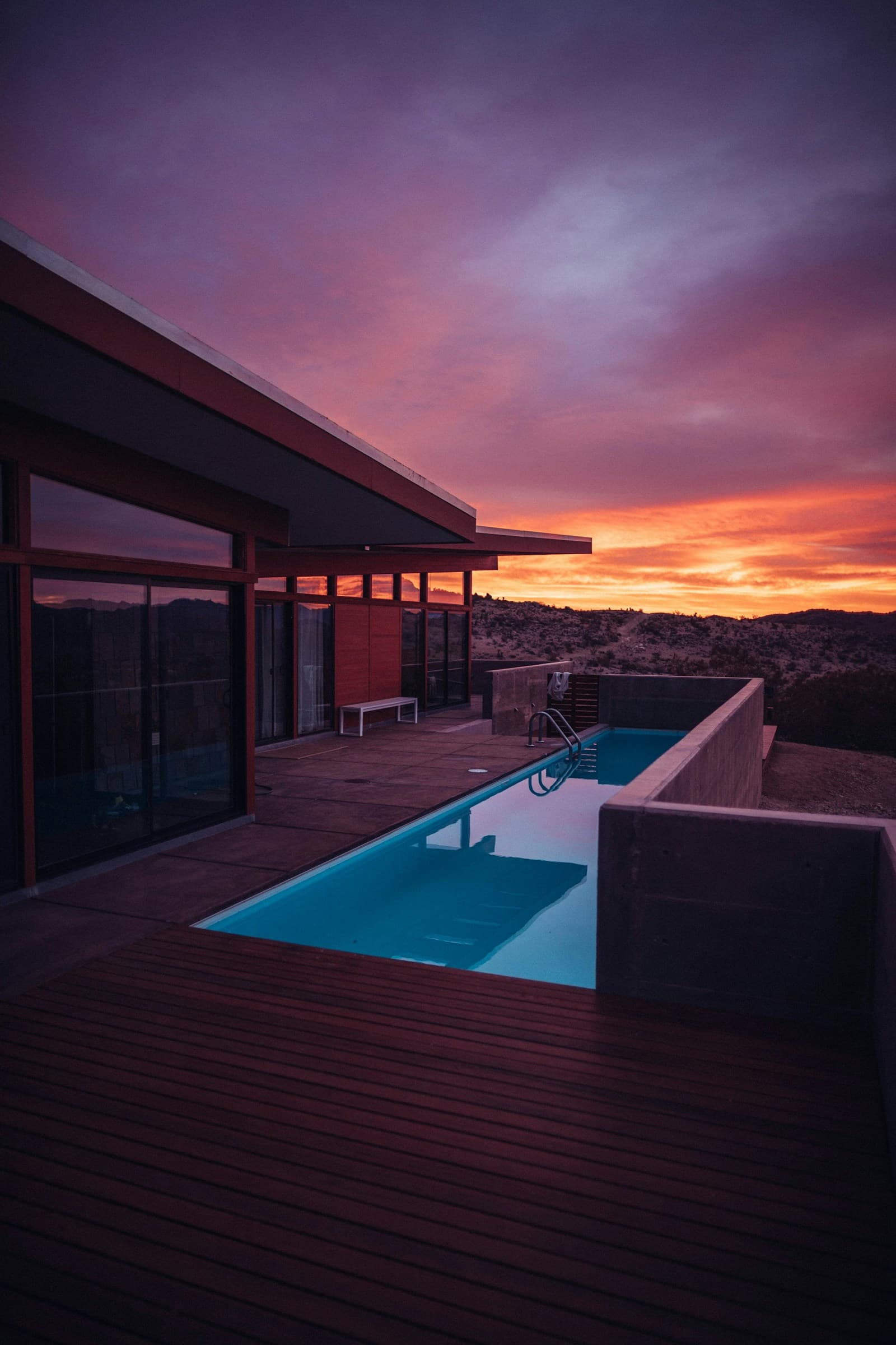 Pool terrace of a modern home at sunset